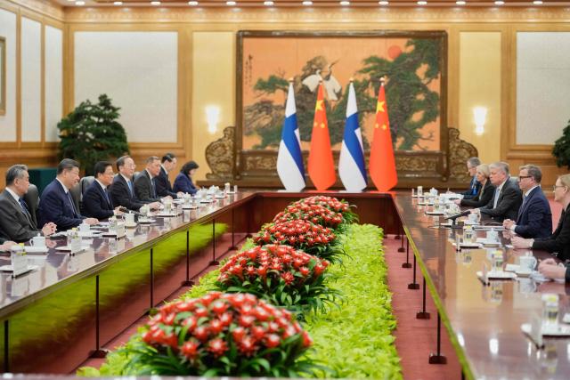 Finland's Prime Minister Petteri Orpo (2nd-R) talks to Chinese President Xi Jinping (2nd-L) during their bilateral meeting at the Great Hall of the People in Beijing on January 27, 2026. (Photo by Vincent Thian / POOL / AFP)