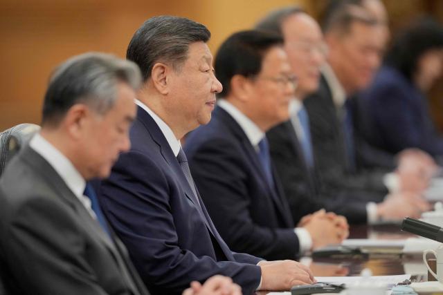 Chinese President Xi Jinping (2nd-L) talks to Finland's Prime Minister Petteri Orpo (not pictured) during their bilateral meeting at the Great Hall of the People in Beijing on January 27, 2026. (Photo by Vincent Thian / POOL / AFP)