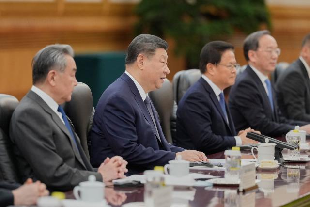 Chinese President Xi Jinping (2nd-L) talks to Finland's Prime Minister Petteri Orpo (not pictured) during their bilateral meeting at the Great Hall of the People in Beijing on January 27, 2026. (Photo by Vincent Thian / POOL / AFP)