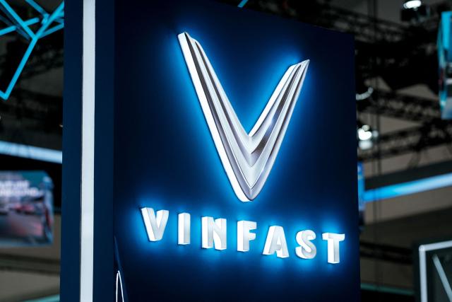 (FILES) VinFast’s logo is seen at its exhibition booth during the 32nd Gaikindo Indonesia International Auto Show (GIIAS) at the Indonesia Convention Exhibition (ICE) in Tangerang, Greater Jakarta, on July 23, 2025. Vietnam's first homegrown electric car manufacturer is partnering with Israeli AI firm Autobrains to upgrade its autonomous driving technology and launch a lower-cost "robo-car" system, VinFast said on January 27, 2026. (Photo by Yasuyoshi CHIBA / AFP)