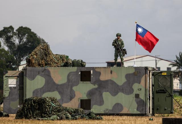 Taiwan military personnel take part in a spring military exercise in Taichung on January 27, 2026. (Photo by I-Hwa Cheng / AFP)