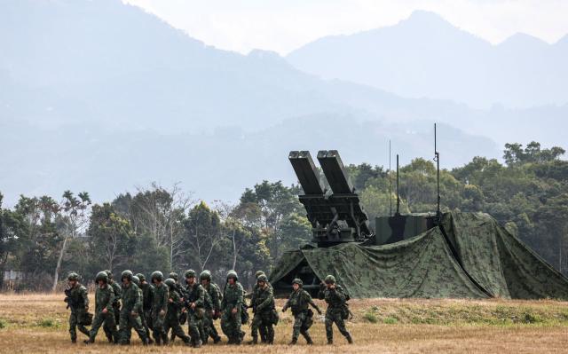 Taiwanese soldiers walk past a Sky Sword II Land-based Air Defence Missile in Taichung on January 27, 2026. (Photo by I-Hwa Cheng / AFP)