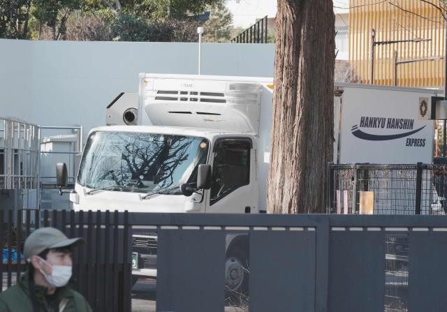 A truck believed to be carrying the twin pandas departs from Ueno Zoo in Tokyo on January 27, 2026, heading towards their return to China. (Photo by Kazuhiro NOGI / AFP)