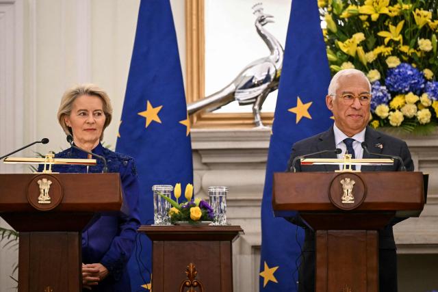 European Commission President Ursula von der Leyen (L) and European Council President Antonio Costa listen as India's Prime Minister Narendra Modi (not pictured) speaks during the joint press statements after their meeting at the Hyderabad House in New Delhi on January 27, 2026. India and the European Union announced on January 27 the "mother of all deals", a huge trade pact to create a market of two billion people, reached after two decades of negotiations. (Photo by Sajjad HUSSAIN / AFP)