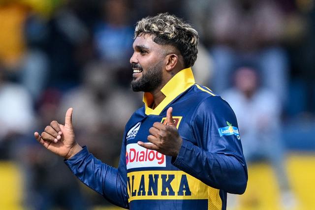 Sri Lanka's Wanindu Hasaranga celebrates after taking the wicket of England's Rehan Ahmed during the third one-day international (ODI) cricket match between Sri Lanka and England at the R. Premadasa International Cricket Stadium in Colombo on January 27, 2026. (Photo by Ishara S. KODIKARA / AFP)