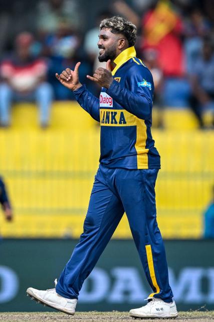 Sri Lanka's Wanindu Hasaranga celebrates after taking the wicket of England's Rehan Ahmed during the third one-day international (ODI) cricket match between Sri Lanka and England at the R. Premadasa International Cricket Stadium in Colombo on January 27, 2026. (Photo by Ishara S. KODIKARA / AFP)