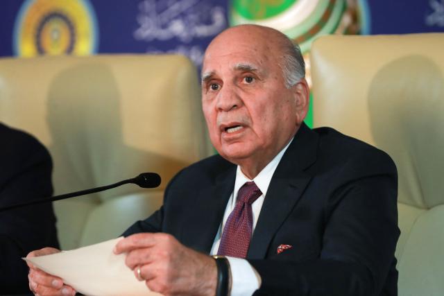 (FILES) Iraqi Foreign Minister Fuad Hussein delivers a speech during the 34th Arab League summit in Baghdad on May 17, 2025. Iraq's parliament will meet on January 27, 2026, to elect the country's new president, a largely ceremonial presidency which goes to a Kurd, who will then appoint a prime minister. The presidency is usually held by the Patriotic Union of Kurdistan (PUK). This year, the rival Kurdistan Democratic Party (KDP) named its own candidate: Foreign Minister Fuad Hussein. By convention, a Shiite Muslim holds the post of prime minister, the parliament speaker is Sunni Muslim. (Photo by AMEER AL-MOHAMMEDAWI / AFP)