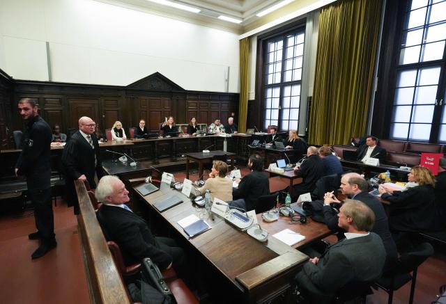 Presiding judge Isabel Hildebrandt (background, 4th R) opens another session in the trial against defendant German entrepreneur and gastronome Christina Block (C-L, beige jumper), over alleged child abduction at the District Court in Hamburg, northern Germany, on January 27, 2026. The public prosecutor's office accuses Block, heiress of a steakhouse chain, of ordering the abduction of her daughter, born in 2010, and her son, born in 2013. According to the indictment, the background to this is an escalating custody dispute over many years between Block and her former husband, who have four children together. (Photo by Marcus Brandt / POOL / AFP)