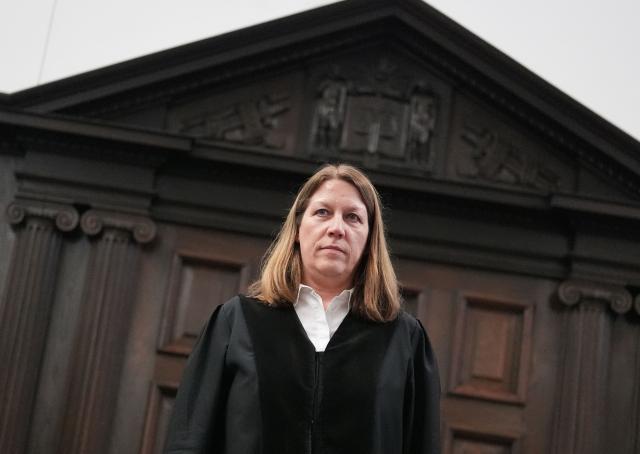Presiding judge Isabel Hildebrandt prepares to open another session in the trial against defendant German entrepreneur and gastronome Christina Block (not in picture) over alleged child abduction at the District Court in Hamburg, northern Germany, on January 27, 2026. The public prosecutor's office accuses Block, heiress of a steakhouse chain, of ordering the abduction of her daughter, born in 2010, and her son, born in 2013. According to the indictment, the background to this is an escalating custody dispute over many years between Block and her former husband, who have four children together. (Photo by Marcus Brandt / POOL / AFP)