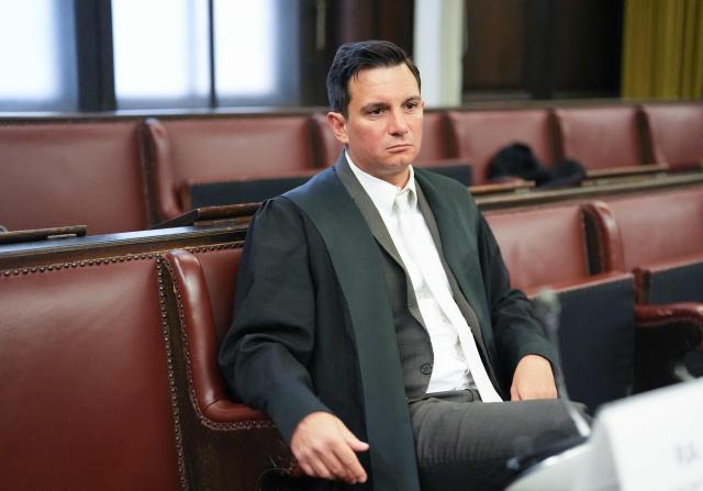 Lawyer Philip von der Meden, representative of the joint plaintiff, waits for the start of another session in the trial against defendant German entrepreneur and gastronome Christina Block (not in picture) over alleged child abduction at the District Court in Hamburg, northern Germany, on January 27, 2026. The public prosecutor's office accuses Block, heiress of a steakhouse chain, of ordering the abduction of her daughter, born in 2010, and her son, born in 2013. According to the indictment, the background to this is an escalating custody dispute over many years between Block and her former husband, who have four children together. (Photo by Marcus Brandt / POOL / AFP)