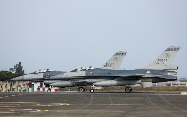 A pair of Taiwanese air force F-16V fighter aircraft prepare for take off at Chiayi Air Base in Chiayi on January 27, 2026. (Photo by I-Hwa Cheng / AFP)