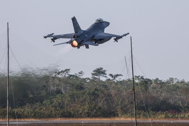 A Taiwanese air force F-16V fighter aircraft takes off during a military exercise at Chiayi Air Base in Chiayi on January 27, 2026. (Photo by I-Hwa Cheng / AFP)