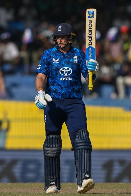 England's Joe Root celebrates after scoring a half-century (50 runs) during the third one-day international (ODI) cricket match between Sri Lanka and England at the R. Premadasa International Cricket Stadium in Colombo on January 27, 2026. (Photo by Ishara S. KODIKARA / AFP)