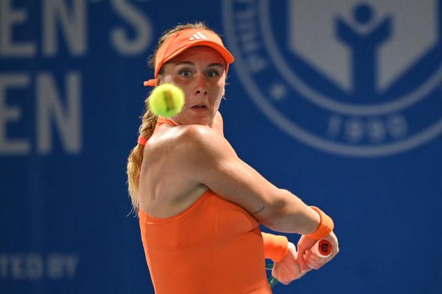 France's Leolia Jeanjean hits a return against Germany's Tatjana Maria during their women's singles match at the Philippine Women's Open tennis tournament in Manila on January 27, 2026. (Photo by Ted ALJIBE / AFP)