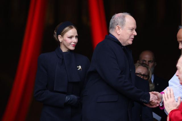 Prince Albert II of Monaco (C) and Princess Charlene of Monaco (L) leave the cathedral after taking part in the traditional festivities of Sainte Devote in the Principalty of Monaco on January 27, 2026. (Photo by Valery HACHE / AFP) / NO TABLOIDS WEB & PRINT, NO DAILY MAIL, NO DAILY MAIL GROUP, NO VOICI, NO CLOSER
