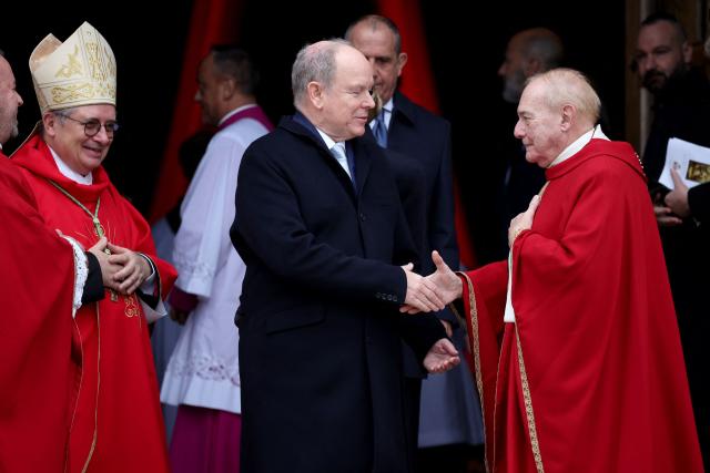 Prince Albert II of Monaco (C) leaves the cathedral after taking part in the traditional festivities of Sainte Devote in the Principalty of Monaco on January 27, 2026. (Photo by Valery HACHE / AFP) / NO TABLOIDS WEB & PRINT, NO DAILY MAIL, NO DAILY MAIL GROUP, NO VOICI, NO CLOSER