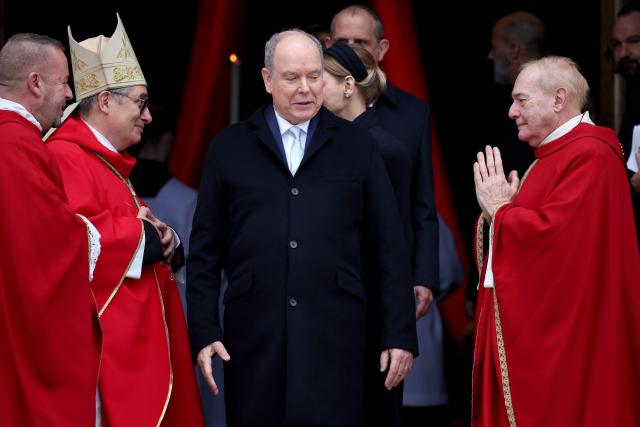 Prince Albert II of Monaco (C) and Princess Charlene of Monaco (C-R) leave the cathedral after taking part in the traditional festivities of Sainte Devote in the Principalty of Monaco on January 27, 2026. (Photo by Valery HACHE / AFP) / NO TABLOIDS WEB & PRINT, NO DAILY MAIL, NO DAILY MAIL GROUP, NO VOICI, NO CLOSER