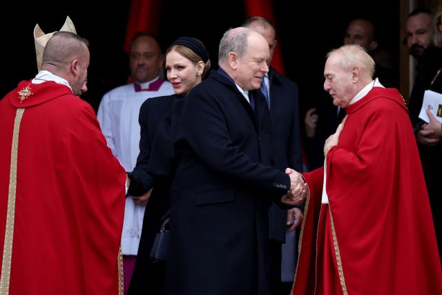 Prince Albert II of Monaco (C) and Princess Charlene of Monaco (C-L) leave the cathedral after taking part in the traditional festivities of Sainte Devote in the Principalty of Monaco on January 27, 2026. (Photo by Valery HACHE / AFP) / NO TABLOIDS WEB & PRINT, NO DAILY MAIL, NO DAILY MAIL GROUP, NO VOICI, NO CLOSER