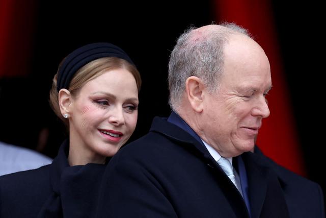 Prince Albert II of Monaco (R) and Princess Charlene of Monaco leave the cathedral after taking part in the traditional festivities of Sainte Devote in the Principalty of Monaco on January 27, 2026. (Photo by Valery HACHE / AFP) / NO TABLOIDS WEB & PRINT, NO DAILY MAIL, NO DAILY MAIL GROUP, NO VOICI, NO CLOSER
