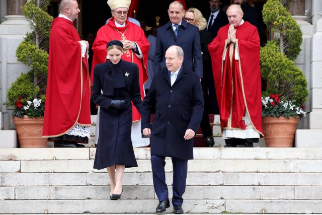 Prince Albert II of Monaco (R) and Princess Charlene of Monaco (L) leave the cathedral after taking part in the traditional festivities of Sainte Devote in the Principalty of Monaco on January 27, 2026. (Photo by Valery HACHE / AFP) / NO TABLOIDS WEB & PRINT, NO DAILY MAIL, NO DAILY MAIL GROUP, NO VOICI, NO CLOSER