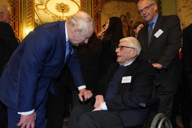Britain's King Charles III (L) speaks with Holocaust survivor Max Snijders (bottom R) during a reception for survivors of the Holocaust and their families at Buckingham Palace in central London on January 27, 2026, held to mark Holocaust Memorial Day. Holocaust Memorial Day takes place every year on January 27, the anniversary of the liberation of the Auschwitz-Birkenau. The day commemorates the six million Jewish people murdered during the Holocaust, and the millions more murdered under Nazi persecution. (Photo by Aaron Chown / POOL / AFP)