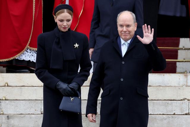 Prince Albert II of Monaco (R) and Princess Charlene of Monaco leave the cathedral after taking part in the traditional festivities of Sainte Devote in the Principalty of Monaco on January 27, 2026. (Photo by Valery HACHE / AFP) / NO TABLOIDS WEB & PRINT, NO DAILY MAIL, NO DAILY MAIL GROUP, NO VOICI, NO CLOSER