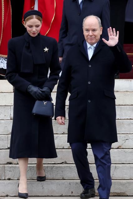 Prince Albert II of Monaco (R) and Princess Charlene of Monaco leave the cathedral after taking part in the traditional festivities of Sainte Devote in the Principalty of Monaco on January 27, 2026. (Photo by Valery HACHE / AFP) / NO TABLOIDS WEB & PRINT, NO DAILY MAIL, NO DAILY MAIL GROUP, NO VOICI, NO CLOSER