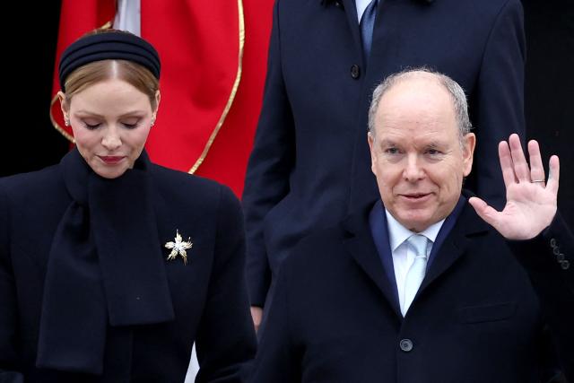 Prince Albert II of Monaco (R) and Princess Charlene of Monaco leave the cathedral after taking part in the traditional festivities of Sainte Devote in the Principalty of Monaco on January 27, 2026. (Photo by Valery HACHE / AFP) / NO TABLOIDS WEB & PRINT, NO DAILY MAIL, NO DAILY MAIL GROUP, NO VOICI, NO CLOSER