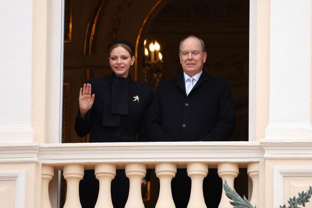 Prince Albert II of Monaco (R) and Princess Charlene of Monaco appear on the balcony during the traditional festivities of Sainte Devote in the Principalty of Monaco on January 27, 2026. (Photo by Valery HACHE / AFP) / NO TABLOIDS WEB & PRINT, NO DAILY MAIL, NO DAILY MAIL GROUP, NO VOICI, NO CLOSER