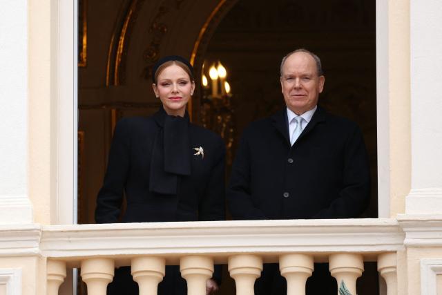 Prince Albert II of Monaco (R) and Princess Charlene of Monaco appear on the balcony during the traditional festivities of Sainte Devote in the Principalty of Monaco on January 27, 2026. (Photo by Valery HACHE / AFP) / NO TABLOIDS WEB & PRINT, NO DAILY MAIL, NO DAILY MAIL GROUP, NO VOICI, NO CLOSER