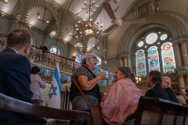 Delegates attend the commemoration of International Holocaust Remembrance Day at the Keneseth Eliyahoo Synagogue in Mumbai on January 27, 2026. (Photo by Punit PARANJPE / AFP)
