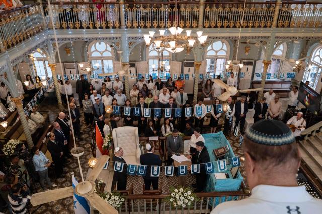 Delegates attend the commemoration of International Holocaust Remembrance Day at the Keneseth Eliyahoo Synagogue in Mumbai on January 27, 2026. (Photo by Punit PARANJPE / AFP)