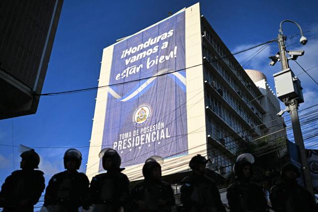 Security forces stand guard outside of the National Congress before the start of the inauguration ceremony of Honduras' President Nasry Asfura in Tegucigalpa on January 27, 2026. Asfura, a conservative businessman, was declared the winner of Honduras's presidential election on December 24, weeks after a tight race marred by delays and allegations of fraud. (Photo by JOHAN ORDONEZ / AFP)