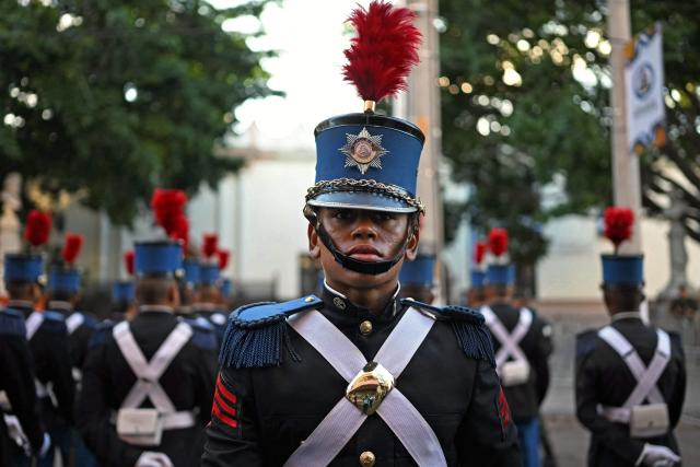 Military cadets stand outside of the National Congress before the start of the inauguration ceremony of Honduras' President-elect Nasry Asfura in Tegucigalpa on January 27, 2026. Asfura, a conservative businessman, was declared the winner of Honduras's presidential election on December 24, weeks after a tight race marred by delays and allegations of fraud. (Photo by JOHAN ORDONEZ / AFP)
