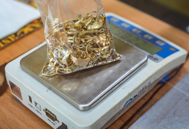 Gold jewelry is pictured at a gold buying shop in Burgos, northern Spain, on January 27, 2026. (Photo by CESAR MANSO / AFP)
