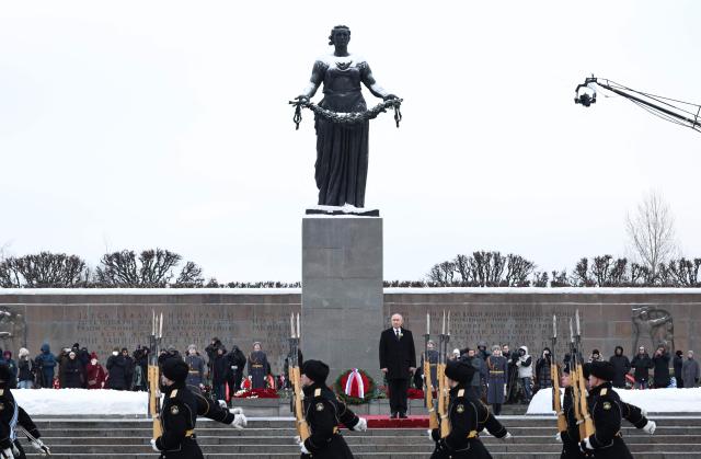 In this pool photograph distributed by the Russian state agency Sputnik, Russia's President Vladimir Putin attends a wreath-laying ceremony at the monument 'Motherland' at the Piskaryovskoye Memorial Cemetery in Saint Petersburg on January 27, 2026, marking the 82nd anniversary of the liberation of Leningrad from Nazi blockade in World War Two. (Photo by Alexander KAZAKOV / POOL / AFP)