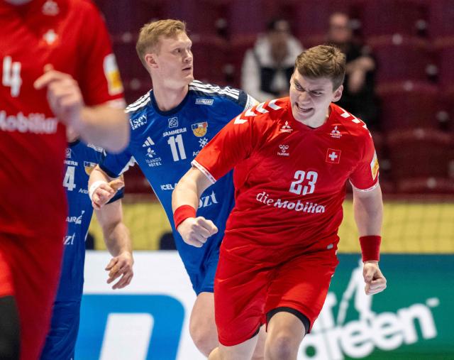 Switzerland's pivot #23 Lukas Laube (R) reacts after a goal during the men's EHF Euro 2026 main round handball match Switzerland v Iceland in Malmoe, Sweden, on January 27, 2026. (Photo by Johan NILSSON / TT NEWS AGENCY / AFP) / Sweden OUT