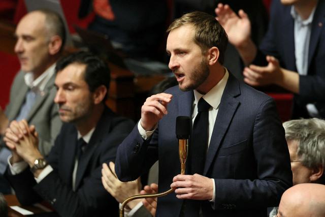 La France Insoumise - Nouveau Front Populaire's MP Francois Piquemal (C)  delivers a speech during a session of questions to the government at The National Assembly, France's lower house parliament, in Paris on January 27, 2026. On January 27, 2026, the Assembly is expected to reject two new motions of no confidence tabled by the left outside the PS and the far right, in response to the Prime Minister's decision to once again use Article 49.3 to push through the expenditure section and the entire state budget for 2026. (Photo by Dimitar DILKOFF / AFP)