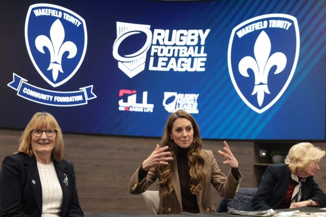 Britain's Catherine (C), Princess of Wales, speaks during a visit to Wakefield Trinity Rugby League club in Wakefield, northern England on January 27, 2026, to learn how their outreach programmes bring generations together and support individuals experiencing isolation in the community. (Photo by Ian Hodgson / POOL / AFP)