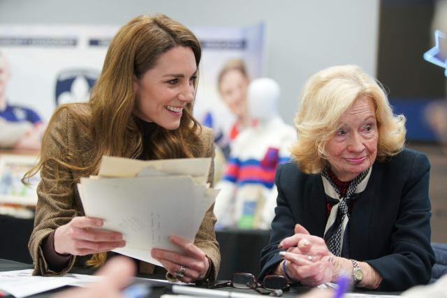 Britain's Catherine (L), Princess of Wales, sits with Molly Fox (R), the wife of Wakefield Trinity legend Peter Fox, during a visit to Wakefield Trinity Rugby League club in Wakefield, northern England on January 27, 2026, to learn how their outreach programmes bring generations together and support individuals experiencing isolation in the community. (Photo by Ian Hodgson / POOL / AFP)