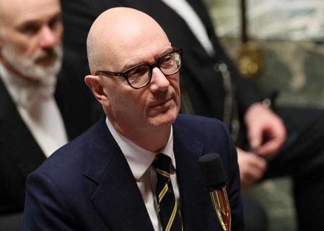France's Economy and Finance Minister Roland Lescure delivers a speech during a session of questions to the government at The National Assembly, France's lower house parliament, in Paris on January 27, 2026. On January 27, 2026, the Assembly is expected to reject two new motions of no confidence tabled by the left outside the PS and the far right, in response to the Prime Minister's decision to once again use Article 49.3 to push through the expenditure section and the entire state budget for 2026. (Photo by Dimitar DILKOFF / AFP)