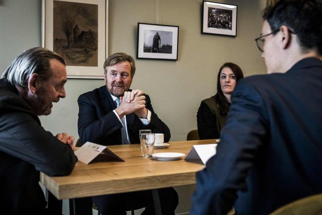 King Willem-Alexander of The Netherlands (C) and National Ombudsman Reinier van Zutphen (L) take part in a meeting during a visit to Zeerijp, in the region of Groningen on January 27, 2026, months after the third-largest earthquakke hit the Groningen region. A 3.4-magnitude earthquake rocked a northern region of The Netherlands on November 14, 2025, one of the strongest ever to hit the area that has been plagued by quakes due to gas extraction. (Photo by Siese VEENSTRA / ANP / AFP) / Netherlands OUT