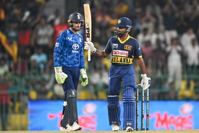 Sri Lanka's Pavan Rathnayake (R) celebrates after scoring a half-century (50 runs) during the third one-day international (ODI) cricket match between Sri Lanka and England at the R. Premadasa International Cricket Stadium in Colombo on January 27, 2026. (Photo by Ishara S. KODIKARA / AFP)