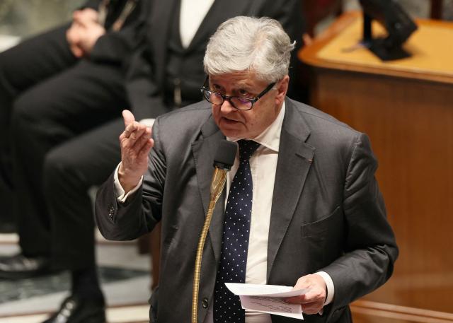 Frances junior Minister in charge of external trade Nicolas Forissier (C) gestures as he delivers a speech during a session of questions to the government at The National Assembly, France's lower house parliament, in Paris on January 27, 2026. On January 27, 2026, the Assembly is expected to reject two new motions of no confidence tabled by the left outside the PS and the far right, in response to Sebastien Lecornu's decision to once again use Article 49.3 to push through the expenditure section and the entire state budget for 2026. (Photo by Dimitar DILKOFF / AFP)