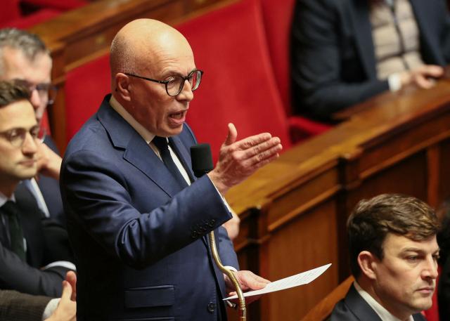 President of UDR parliamentary group Eric Ciotti (C) gestures as he delivers a speech during a session of questions to the government at The National Assembly, France's lower house parliament, in Paris on January 27, 2026. On January 27, 2026, the Assembly is expected to reject two new motions of no confidence tabled by the left outside the PS and the far right, in response to Sebastien Lecornu's decision to once again use Article 49.3 to push through the expenditure section and the entire state budget for 2026. (Photo by Dimitar DILKOFF / AFP)