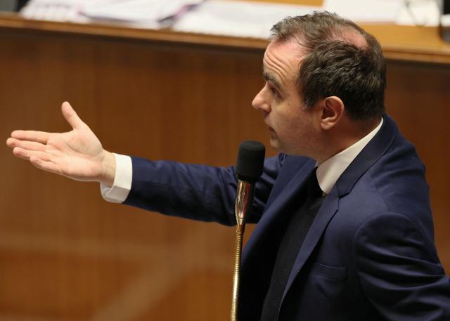 France's Prime Minister Sebastien Lecornu gestures as he delivers a speech during a session of questions to the government at The National Assembly, France's lower house parliament, in Paris on January 27, 2026. On January 27, 2026, the Assembly is expected to reject two new motions of no confidence tabled by the left outside the PS and the far right, in response to Sebastien Lecornu's decision to once again use Article 49.3 to push through the expenditure section and the entire state budget for 2026. (Photo by Dimitar DILKOFF / AFP)