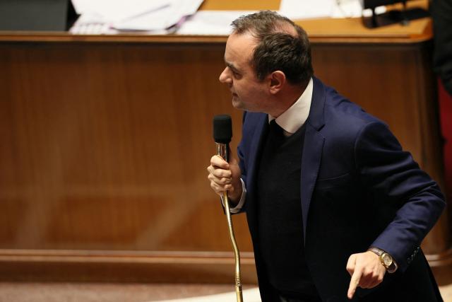 France's Prime Minister Sebastien Lecornu gestures as he delivers a speech during a session of questions to the government at The National Assembly, France's lower house parliament, in Paris on January 27, 2026. On January 27, 2026, the Assembly is expected to reject two new motions of no confidence tabled by the left outside the PS and the far right, in response to Sebastien Lecornu's decision to once again use Article 49.3 to push through the expenditure section and the entire state budget for 2026. (Photo by Dimitar DILKOFF / AFP)