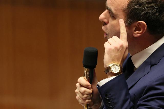 France's Prime Minister Sebastien Lecornu gestures as he delivers a speech during a session of questions to the government at The National Assembly, France's lower house parliament, in Paris on January 27, 2026. On January 27, 2026, the Assembly is expected to reject two new motions of no confidence tabled by the left outside the PS and the far right, in response to Sebastien Lecornu's decision to once again use Article 49.3 to push through the expenditure section and the entire state budget for 2026. (Photo by Dimitar DILKOFF / AFP)