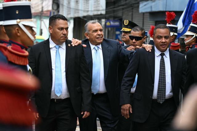 Former Honduran President (2010-2014) Porfirio Lobo (C) arrives at the inauguration ceremony of President-elect Nasry Asfura in Tegucigalpa on January 27, 2026. Asfura, a conservative businessman, was declared the winner of Honduras's presidential election on December 24, weeks after a tight race marred by delays and allegations of fraud. (Photo by Johan ORDÓÑEZ / AFP)
