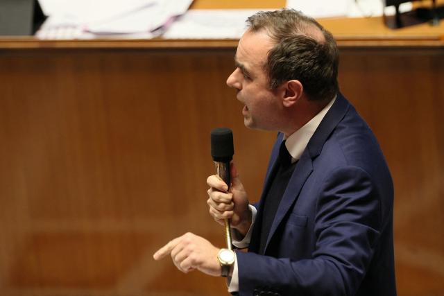 France's Prime Minister Sebastien Lecornu gestures as he delivers a speech during a session of questions to the government at The National Assembly, France's lower house parliament, in Paris on January 27, 2026. On January 27, 2026, the Assembly is expected to reject two new motions of no confidence tabled by the left outside the PS and the far right, in response to Sebastien Lecornu's decision to once again use Article 49.3 to push through the expenditure section and the entire state budget for 2026. (Photo by Dimitar DILKOFF / AFP)